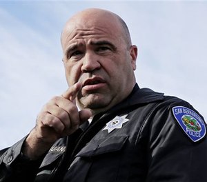 San Bernardino Police Chief Jarrod Burguan takes a question at a press conference.
