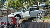Tesla crashes down Calif. embankment, lands on Falck ambulance