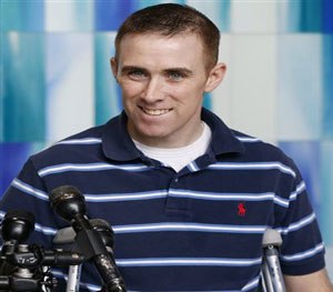 In this June 14, 2013 file photo, transit police officer Richard Donohue speaks with reporters before leaving Spaulding Rehabilitation Hospital in Boston. (AP Images)