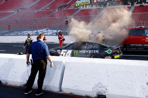 Driver Ty Gibbs (54) exits his after an on-track incident during practice for the NASCAR Clash at the Coliseum at Los Angeles Coliseum on Feb. 4.