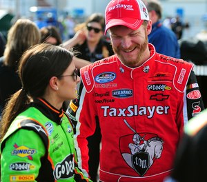 NASCAR Nationwide Series drivers Danica Patrick and Dale Earnhardt Jr. talk following their qualifying laps for the DRIVE4COPD 300 at Daytona International Speedway.