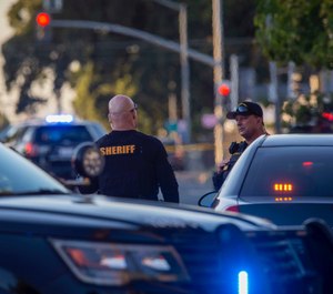 Sacramento police continue to block off the scene where a police officer was fatally shot in Sacramento, Calif., Thursday, June 20, 2019. (AP Photo/Don Thompson)