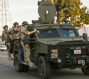 In this Dec. 2, 2015 file photo, authorities search an area near where police stopped a suspected vehicle in San Bernardino, Calif. State lawmakers want to see if lessons can be learned from the way first responders reacted to the San Bernardino terror attack that killed 14 people last year.