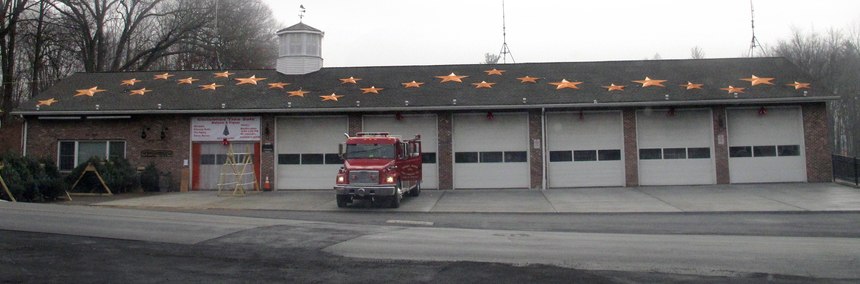 In this 2015 photo, 26 stars decorate the roof of the Sandy Hook Volunteer Fire & Rescue Co. firehouse in Newtown, Conn.