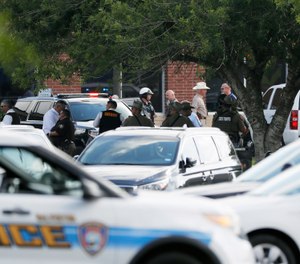 Emergency responders from multiple agencies work at the scene in front of Santa Fe High School in response to a shooting in Santa Fe, Texas. (Kevin M. Cox/The Galveston County Daily News via AP, File)