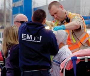 Journalists don't have a HIPAA obligation, but the composition of this photo protects the identity of the man that was injured fleeing from police.