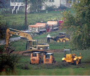 Demolition workers remove debris from the West Nickel Mines Amish School after demolition crews razed the schoolhouse before dawn in Nickel Mines, Pennsylvania, Thursday, October 12, 2006. (Barbara L. Johnston/Philadelphia Inquirer/MCT)