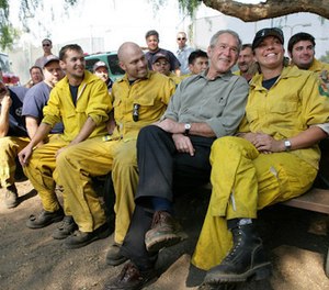 President George W. Bush visits a base camp Oct. 25, 2007, for first responders battling the Southern California wildfires.