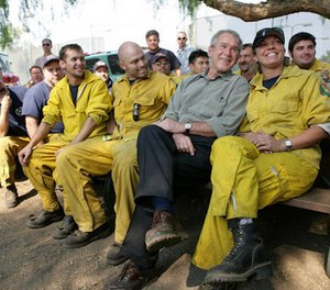 President George W. Bush visits a base camp Oct. 25, 2007, for first responders battling the Southern California wildfires.