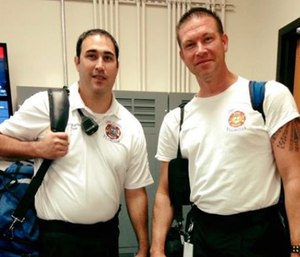 Battalion Chief Dan Miller (right) called 911 and told an operator that he thought he was having a heart attack.