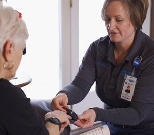 Abby Williamson, community paramedic in East Tennessee, takes vital signs during a home visit as part of Covenant Health's new initiative, Advanced Care at Home. Through this program, community paramedics from Global Medical Response can provide high-acuity medical services for patients in their homes (such as X-rays, ultrasounds, catheters, IVs and more). Recently,12 EMS professionals became certified as community paramedics.