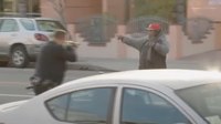 Video: Hammer-wielding man charges at LAPD officers