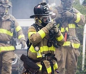 Firefighting hoods are being developed to be a key component of standard firefighting gear.