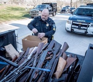 Ninety-eight guns were found across the home.