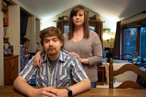 Sean Deines and his wife, Rebekah Deines, at their home in Hendersonville, N.C. While the couple were traveling in Wyoming in 2020, Sean got very ill and was diagnosed with an aggressive leukemia. An air ambulance transferred him to a hospital in North Carolina ― and generated a bill that was nearly $500,000.