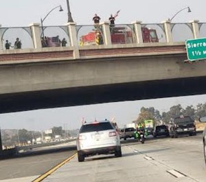 Norton says a cellphone photo taken by her son less than a minute before the crash bolsters a firefighter's claim about the presence of the Engine 79 crew on the overpass.