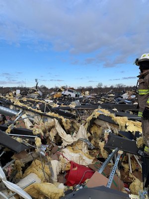 First responders survey damage from the EF-4 tornado that slammed into the Graves County Jail and hit a candle factory where seven inmates were on a work release program.