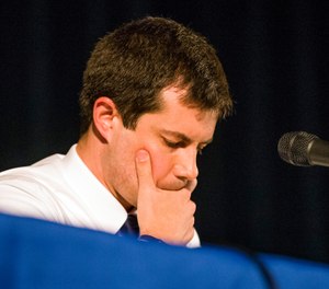 Democratic presidential candidate and South Bend Mayor Pete Buttigieg looks down during a town hall community meeting, Sunday, June 23, 2019, at Washington High School in South Bend, Ind. (Robert Franklin/South Bend Tribune via AP)