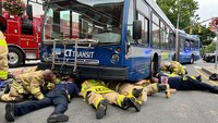 Conn. firefighters rescue woman hit by bus, trapped underneath