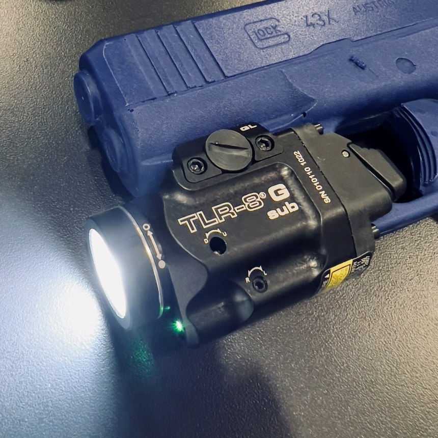 Lindsey has resisted using dedicated (gun-mounted) lights for a variety of reasons. Finally, the Streamlight TLR-8SUB G has changed his outlook on mounted lights. It is tiny, bright, and easy to control without changing anything about the grip. 