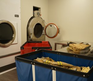 Advanced cleaning subjects garments to laundering in a washer/extractor, a specialized laundry machine that is of a frontloading design and generally has a capacity of 30 pounds (of laundry) or more.