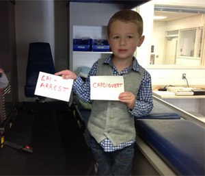 A pediatric patient helps paramedic students learn about medication administration. (Photo courtesy Bob Sullivan)