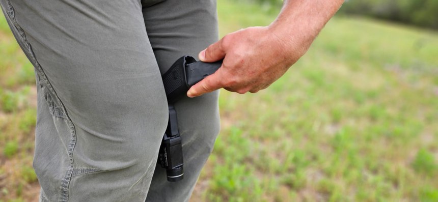 When reloading with a support hand, there are several techniques you can use to hold and stabilize your pistol as you insert new magazines. It's better to try these in training than in a deadly battle.