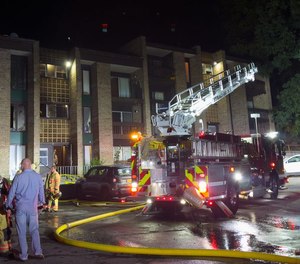 Syracuse firefighters used ladders to rescue trapped occupants at an apartment fire.