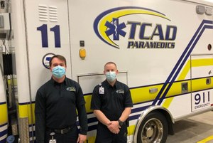 Paramedics Shea Lathrum and Brandon Busch were at the right place at the right time to save an unconscious driver from a vehicle fire.