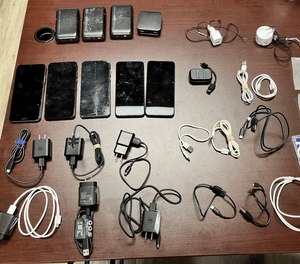 Officials seized cellphones, charges and pills.