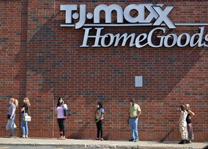 Shoppers wait to get into a newly reopened TJ Maxx and Homegoods in Massachusetts. Big box stores and the charitable foundations they operate have continued to serve their communities throughout the pandemic. Image: T&G Staff/Christine Peterson via TNS