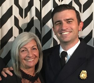 Ben Thompson poses with his first station caption, his mom.
