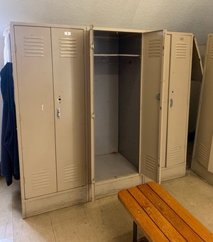 An empty locker left behind by a recent resignation.