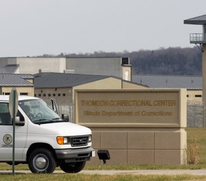 In this May 21, 2010 file photo, a van drives past the Thomson Correctional Center in Thomson, Ill.