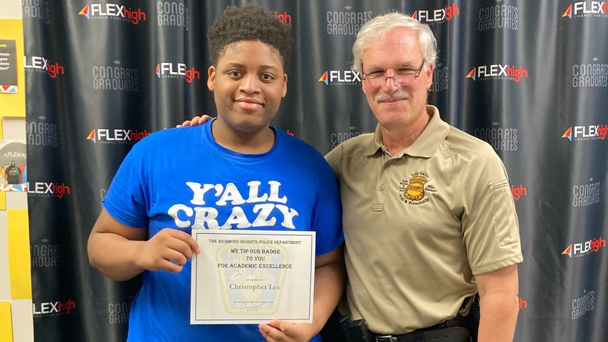 Chief Tom Wetzel is pictured with a "Tip your badge" recipient.