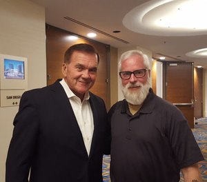 Former Secretary of Homeland Security Tom Ridge (left) takes time to visit with PoliceOne Editor-at-Large Doug Wyllie. (PoliceOne Image)