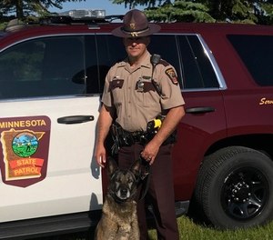 Trooper Doug Rauenhorst with K-9 Diesel on July 9, 2019. The pair worked together for over eight years.