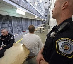 DOC officers are shown with an inmate during a media tour at the Utah State Correctional Facility in Draper, Utah.