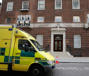 An ambulance passes the entrance to the Lindo Wing at St Mary's Hospital in London, Tuesday, July 2, 2013.