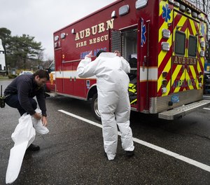 Auburn Firefighter-medic Tess DiDinato and and Firefighter-EMT Nick Fairbanks prepare to go on a call Thursday.