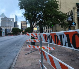 Barriers sit on the sidewalk at the 400 block of Sixth Street in Austin, Texas, where a man shot 14 people early on June 12. (file photo)