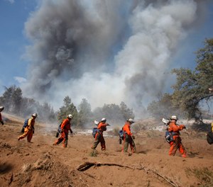 Inmate firefighters help combat a wildfire in Tehachapi, Calif., in 2010.(John W. Adkisson/Los Angeles Times/TNS)