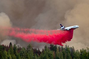 An air tanker drops fire retardant on the Mosquito Fire as smoke fills the sky above Foresthill, Calif. on Sept. 7.