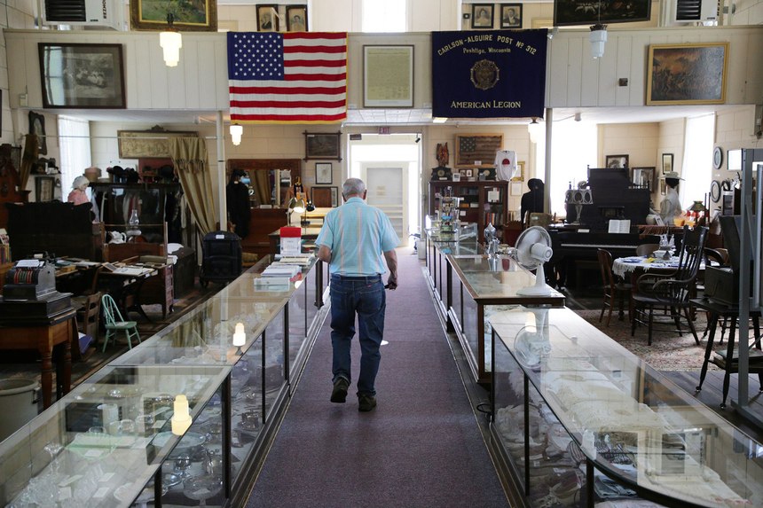 Cubby Couvillion, 95, walks down the aisle of the Peshtigo Fire Museum on Sept. 1, 2021, in Peshtigo, Wisconsin.