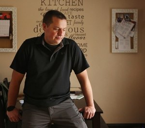 Former Cleveland paramedic Charles Cali sits in his kitchen January 8, 2019. Cali left his job because the city won't agree to mental health protections for its EMS workers. (Photo/Gus Chan, The Plain Dealer)