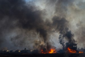 Two homes burned in a wildfire Thursday in Louisville, Colo.