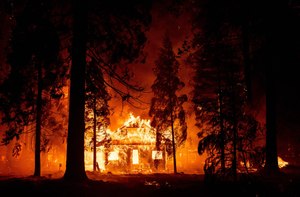 A home burned as flames from the Dixie Fire tore through Plumas County, Calif. on July 24, 2021.