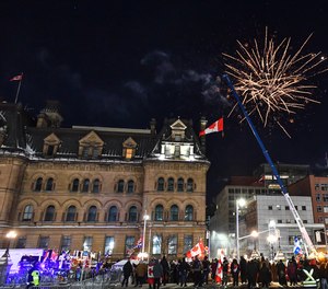 Fireworks are set off into the sky near Parliament Hill as protesters against vaccine mandates continue to gather on Feb. 5, 2022, in Ottawa, Canada.