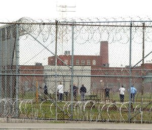 Inmates at Marion Correctional Institution in Marion exercise in the prison yard.