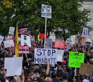 Municipal workers take part in a demonstration to protest against the COVID-19 vaccine mandate, in New York on Oct. 25, 2021.
